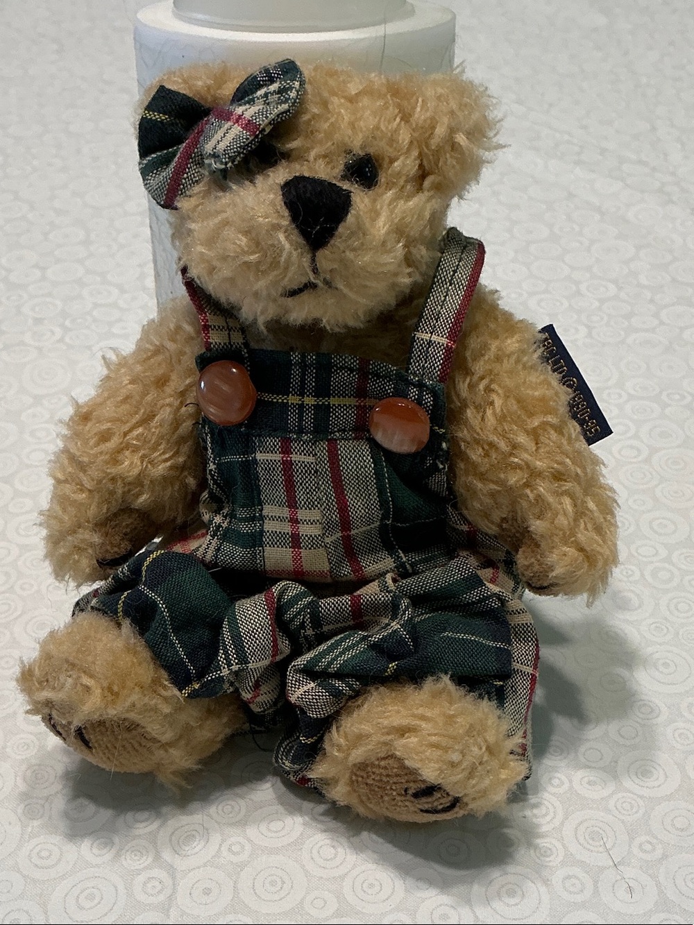 This is a Boyds Bear Becky plush featuring green plaid overalls.